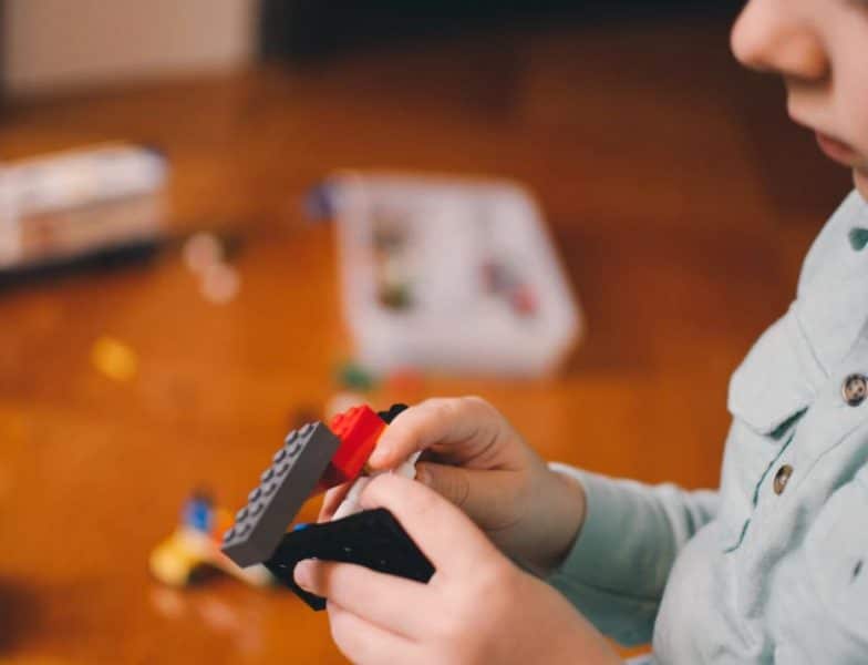 A child playing with Lego