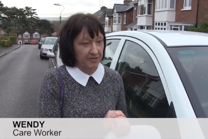 Wendy works as a carers in an agency she is pictured by her car who uses the current parking permit scheme