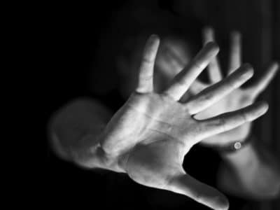 Hands against black and white background