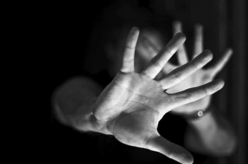 Hands against black and white background