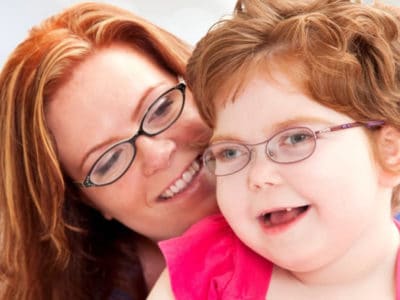 woman smiling with young girl