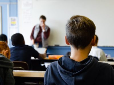 a boy sat in a classroom