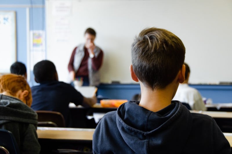 a boy sat in a classroom