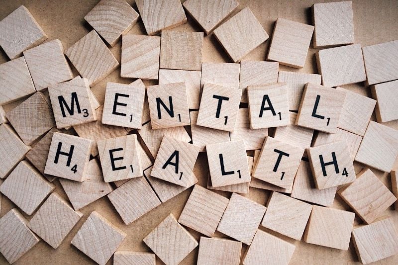 Scrabble tiles spelling out "mental health"