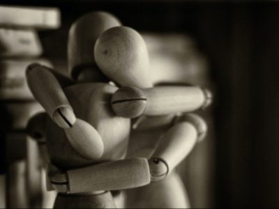 Two wooden manikins hugging