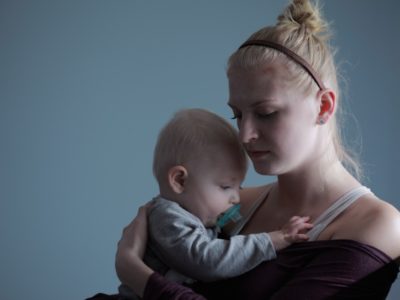 A mother holding her baby