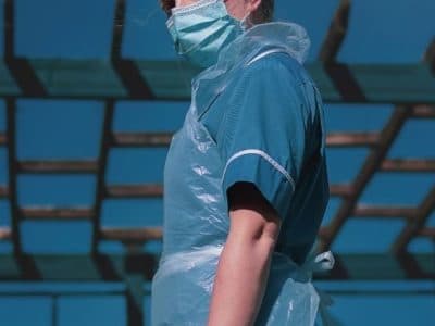 A nurse wearing personal protective equipment