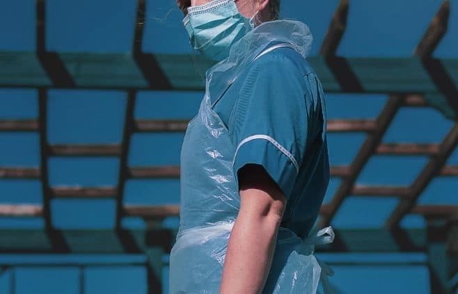 A nurse wearing personal protective equipment