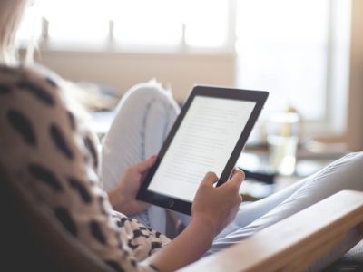 a woman holding an tablet computer