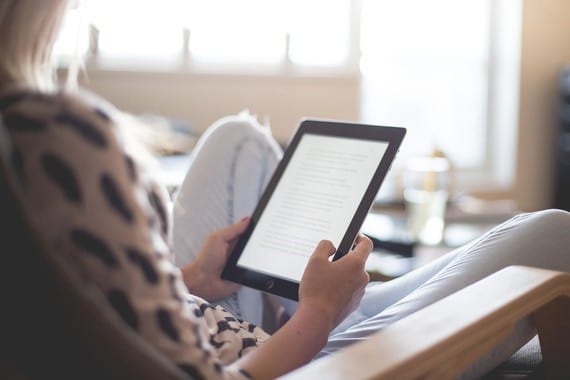 a woman holding an tablet computer