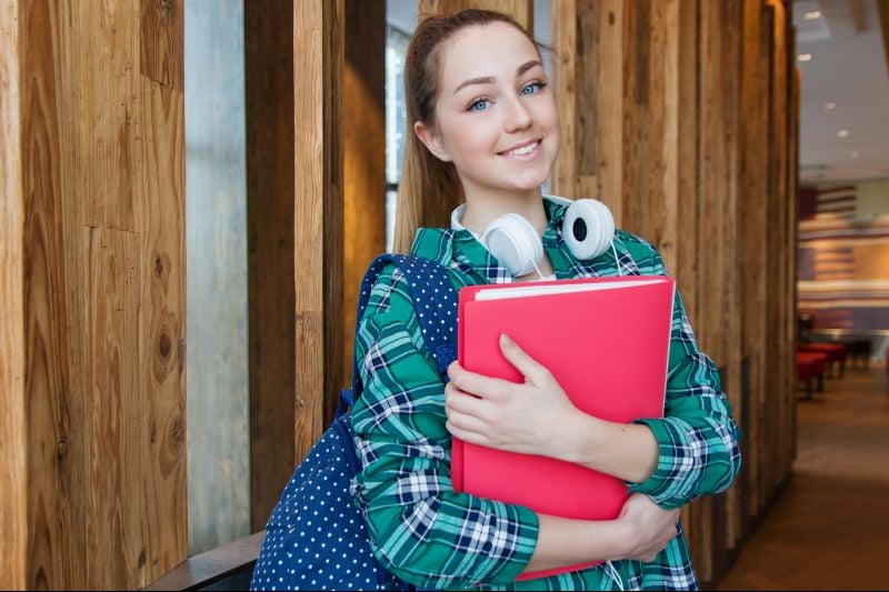 a female student holding a folder