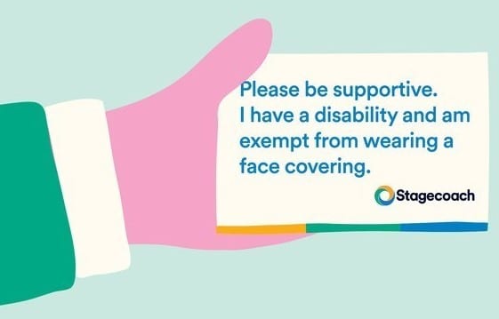 an illustration of a hard holding a card. The card says "please be supportive. I have a disability and am exempt from wearing a face covering"