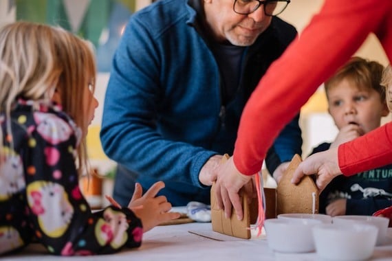 a family making a gingerbread house