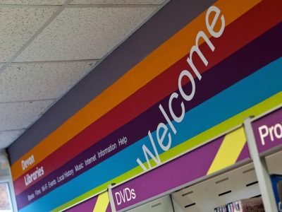 a welcome sign in a Devon library