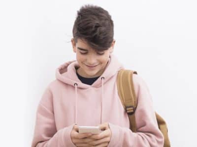 a young person using a mobile phone