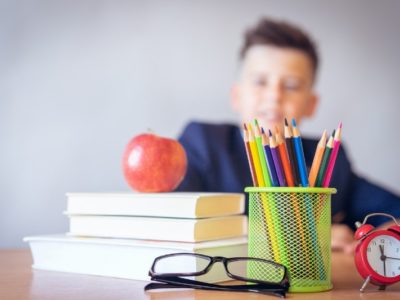 a boy looking at a tidy desk