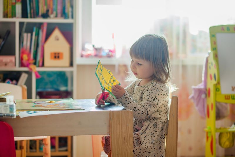 a girl doing arts and crafts