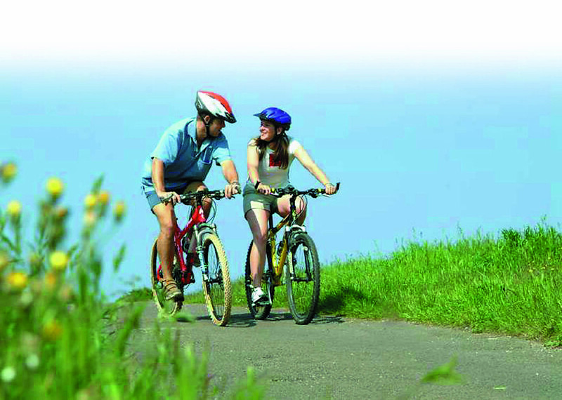 two people riding bikes