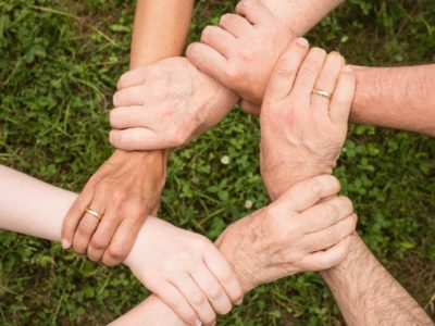 a circle of people holding hands