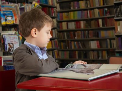 a boy reading a book