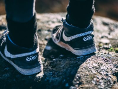 a young person's feet in trainers