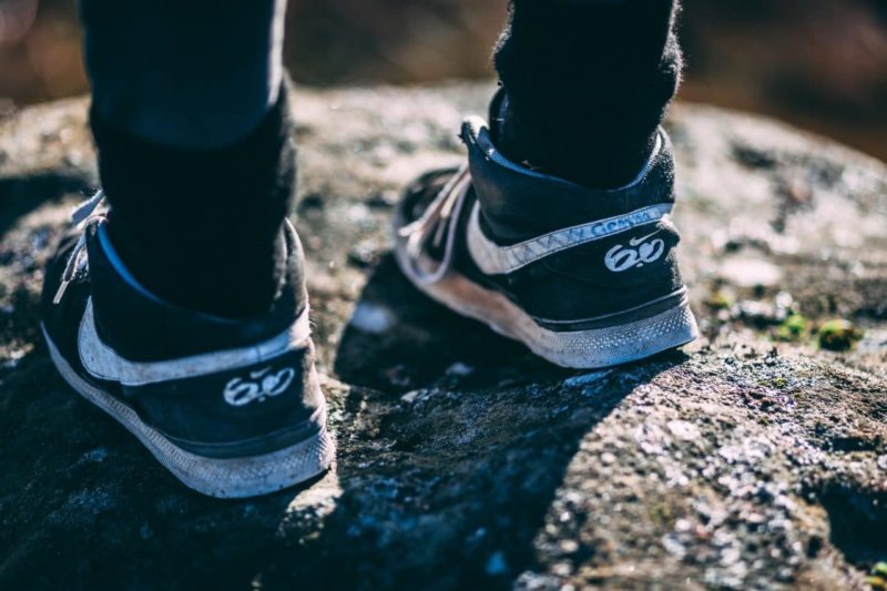 a young person's feet in trainers