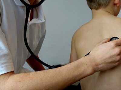 a doctor giving a child a health check