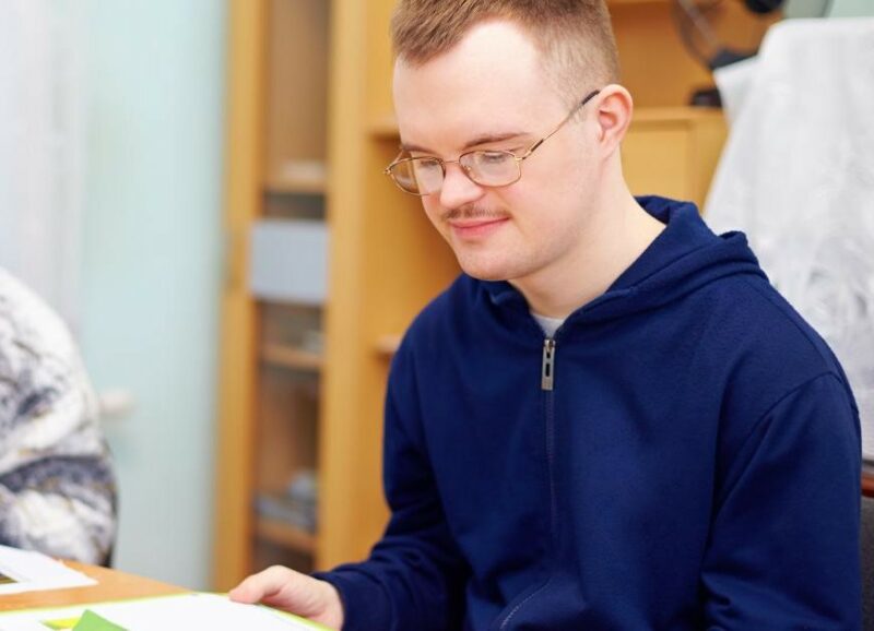 Teenage boy reading a book