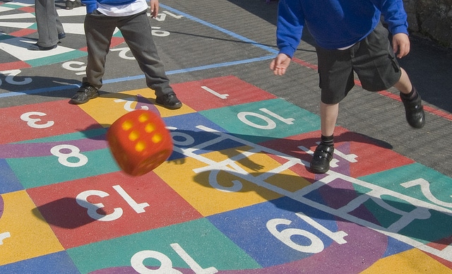 school children playing in a playground